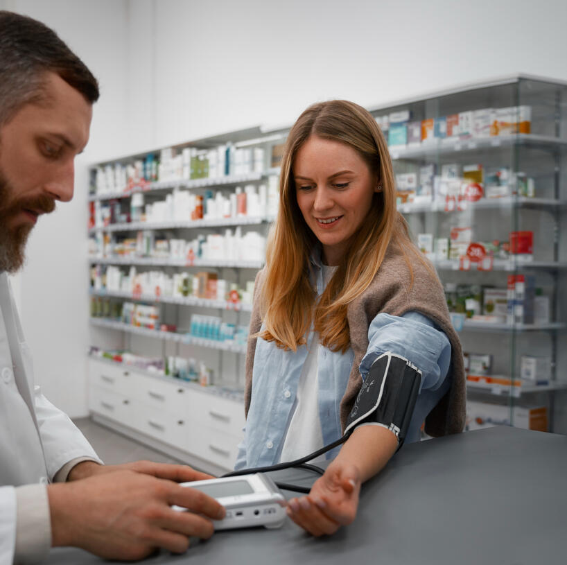 Pharamacist talking to her patient