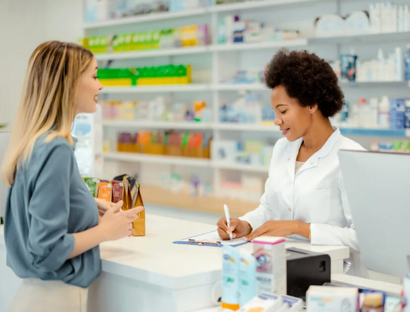Pharmacist consulting patient