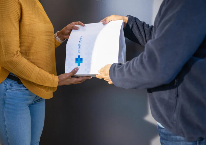 Pharamacist talking to her patient